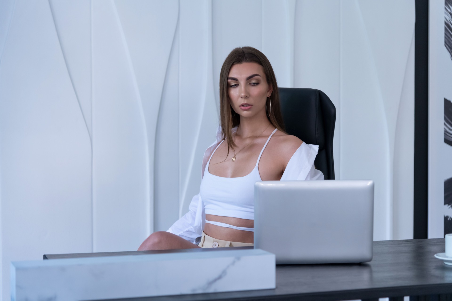 Brunette woman sitting at desk